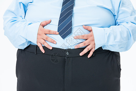 肥胖商务男性摸着肚子背景图片