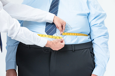 肥胖商务男性量腰围高清图片