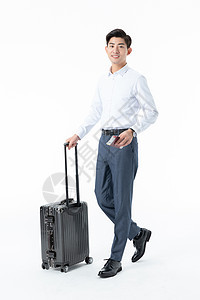 商务男性推着行李箱图片