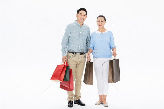 中年夫妇提手拎袋购物图片