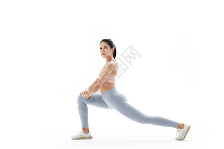 压腿热身的运动女性图片