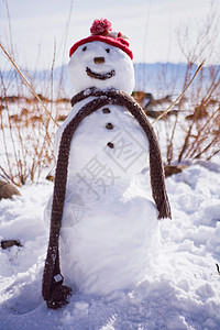 戴帽子戴围巾的微笑雪人背景图片