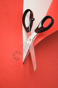 剪红纸的剪刀背景图片