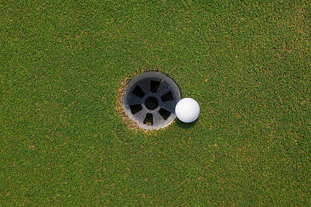 高尔夫球和球洞背景图片