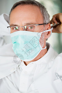 口罩眼镜戴口罩的牙医背景