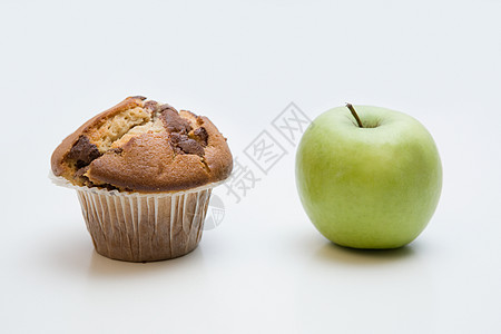 一个松饼和一个苹果高清图片