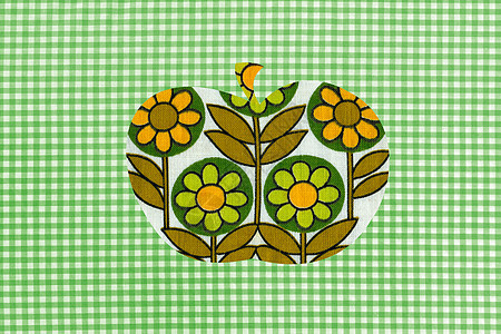 绿色格纹背景上的花苹果图片