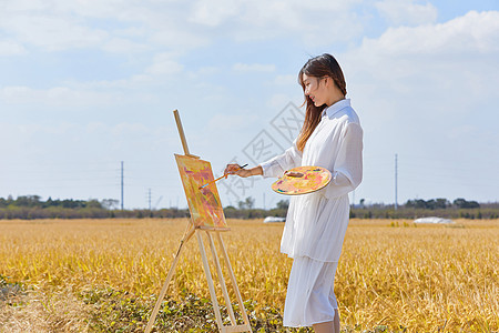 文艺清新美女户外油画写生图片