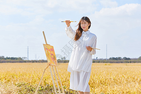 文艺清新美女户外油画写生图片