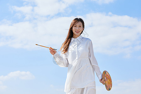 文艺清新美女户外油画写生图片