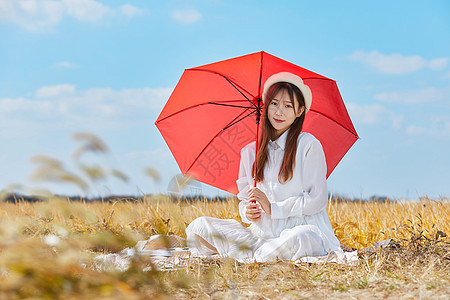 文艺美女手撑红色雨伞图片