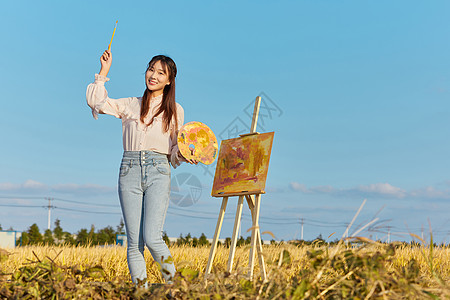 文艺清新美女户外油画写生图片