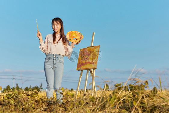 文艺清新美女户外油画写生图片