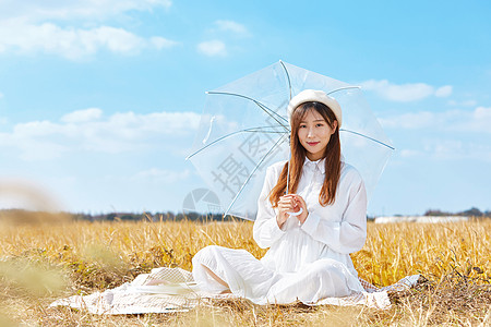 文艺美女手撑雨伞背景图片