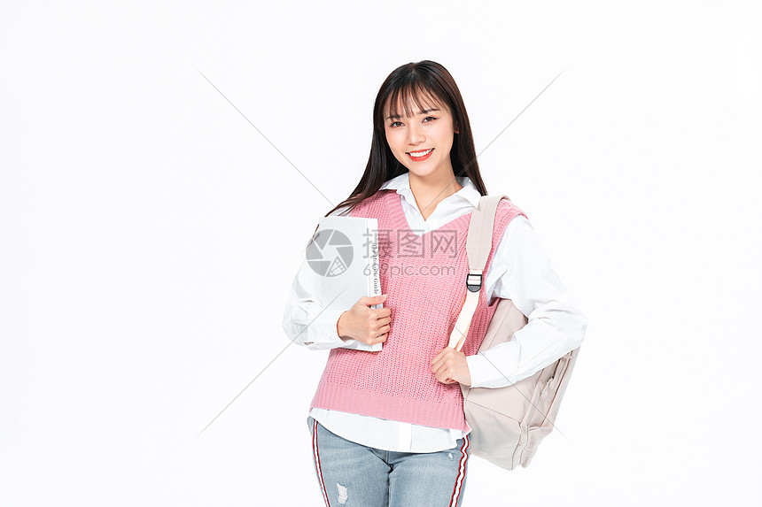 成人教育美女大学生背包抱书本图片
