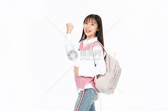 成人教育美女大学生背包抱书本加油图片