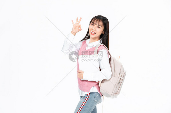 成人教育美女大学生背包抱书本ok图片