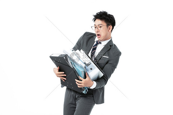 商务男性抱着很多文件夹图片