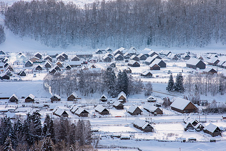 新疆禾木冬季雪景村落木屋风光旅行大雪高清图片素材