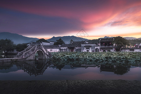 山水荷花安徽宏村山水晚霞风光背景