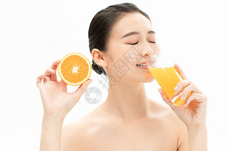 美妆少女喝橙汁图片