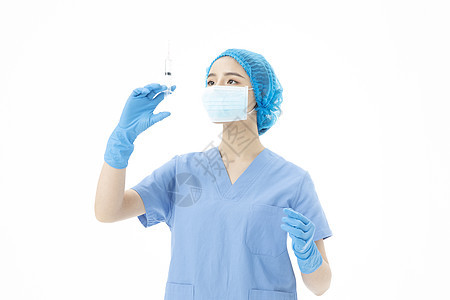 女性医生手术服拿着针筒打针图片