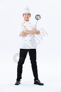 厨师拿大勺手握擀面杖和大勺的厨师背景