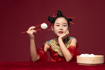 中国风潮流儿童筷子夹着包子背景图片