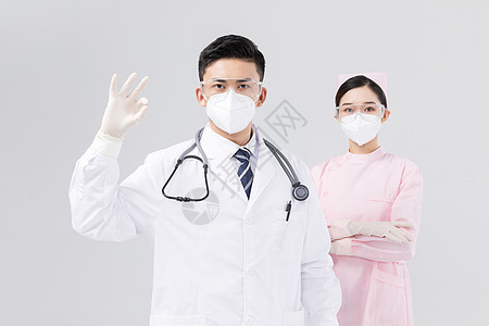 佩戴口罩与护目镜的医生与护士背景图片