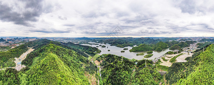 贵阳观山湖航拍贵阳阿哈乌云密布全景图背景