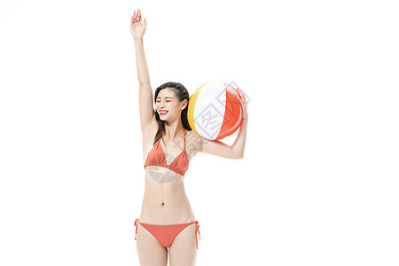 青年泳装美女玩沙滩排球图片