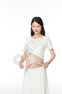 孕妇用皮尺量肚子维度图片