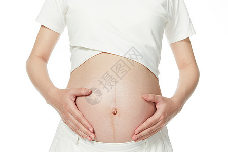 孕妇手扶肚子特写图片