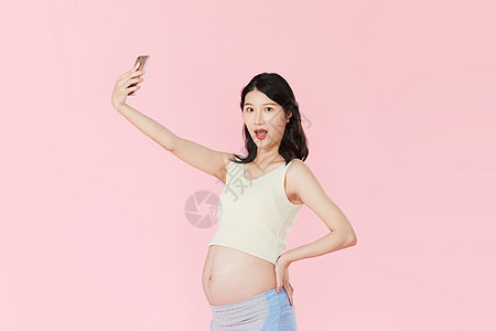年轻孕妇用手机自拍图片