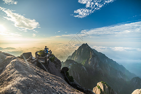 景区游客黄山日出云海游客背影背景