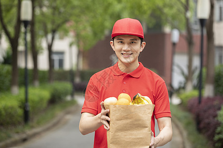 快递小哥生鲜水果配送服务背景图片