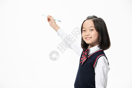 小学生拿笔写字图片