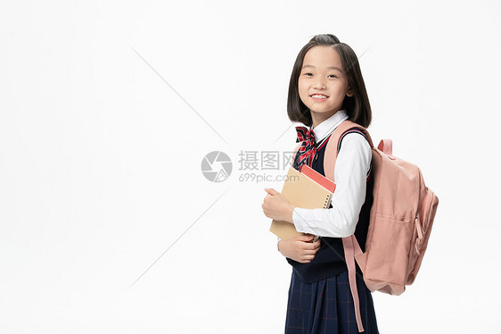 小学生背书包手拿书本形象图片