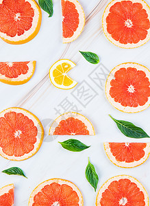 新鲜的红柚和柠檬水果背景图片