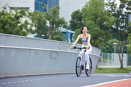 健身自行车女性户外运动骑行背景