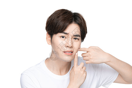 女性摸脸上的痘痘思考照片  |青年男性用手挤痘痘照片  |美女脸上长