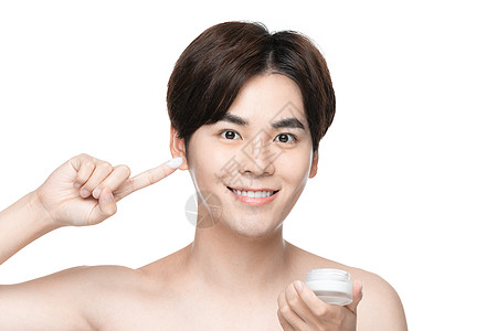 男性护肤面部护理涂面霜背景图片
