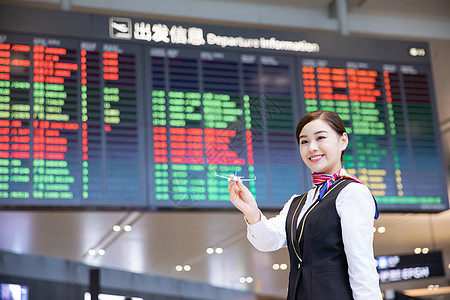 机场空姐拿飞机模型图片