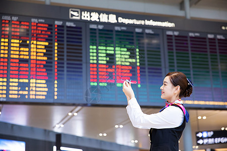 机场空姐拿飞机模型背景图片