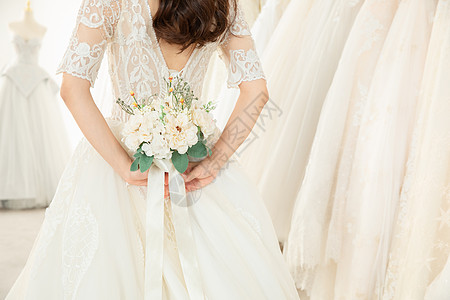 新娘子拿手捧花的婚纱美女特写背景