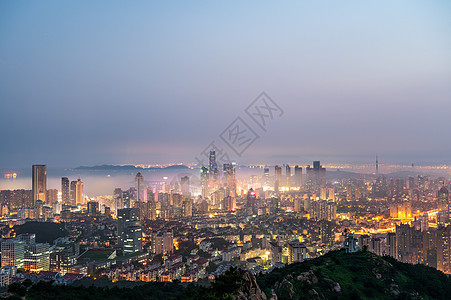 青岛平流雾城市夜景灯光秀背景图片