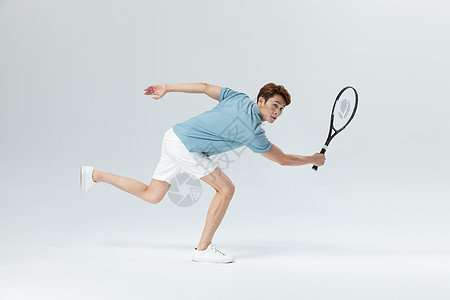 年轻男子年轻活力男子打网球背景