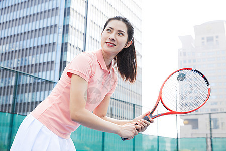 打网球的活力女性背景图片