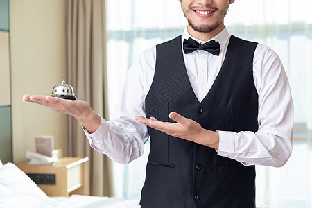 酒店客房服务员拿服务铃酒店服务高清图片素材