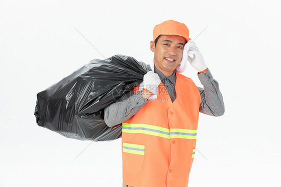 背垃圾袋的环卫工人图片
